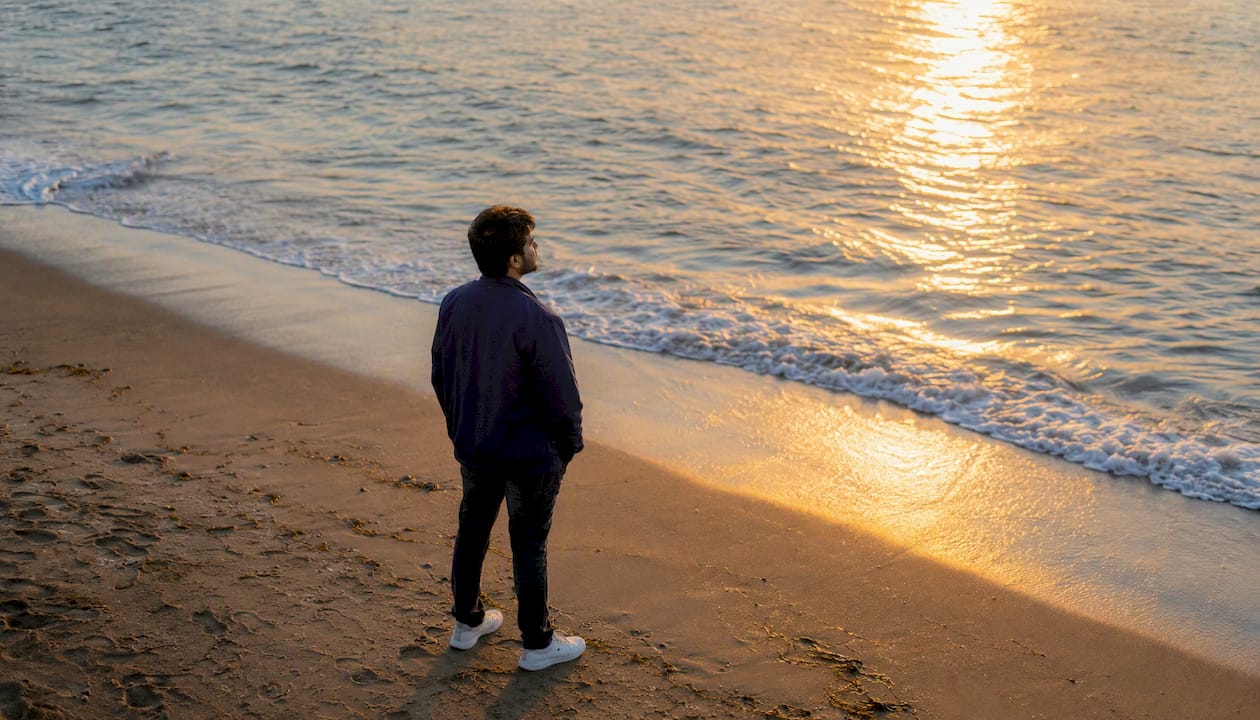 Man reflecting outdoors under soft sunlight
