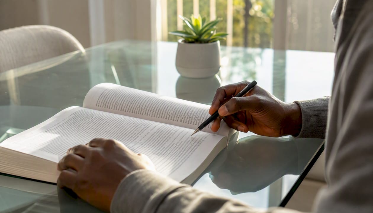 Hands pointing at English reading text