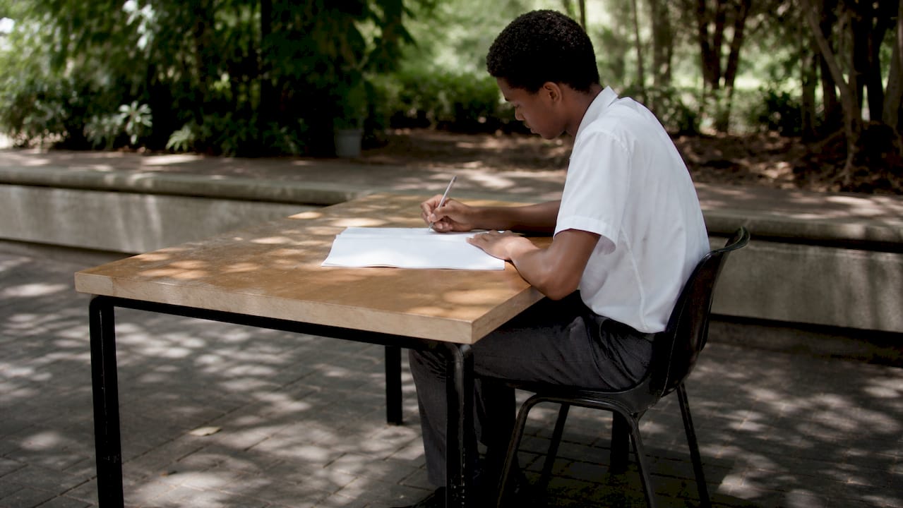 Learner writing English Paper 2 exam