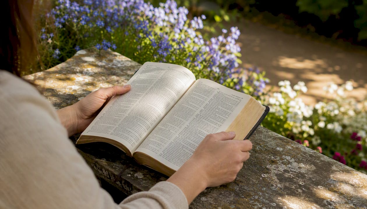 Hands holding Bible open to Psalm 34