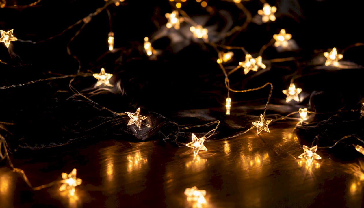 Warm glowing star-shaped fairy lights close-up