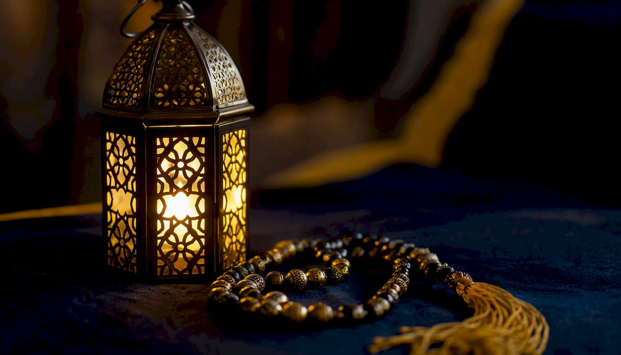Ramadan lantern and prayer beads close-up