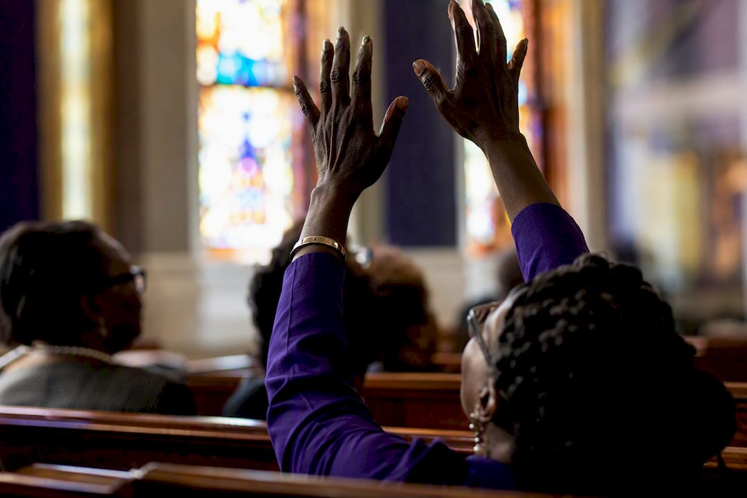 Raised hands in African American church worship