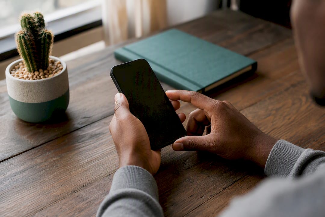 Hands adjusting notification filters on smartphone