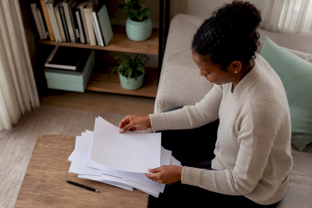 Hands sorting learnership application documents