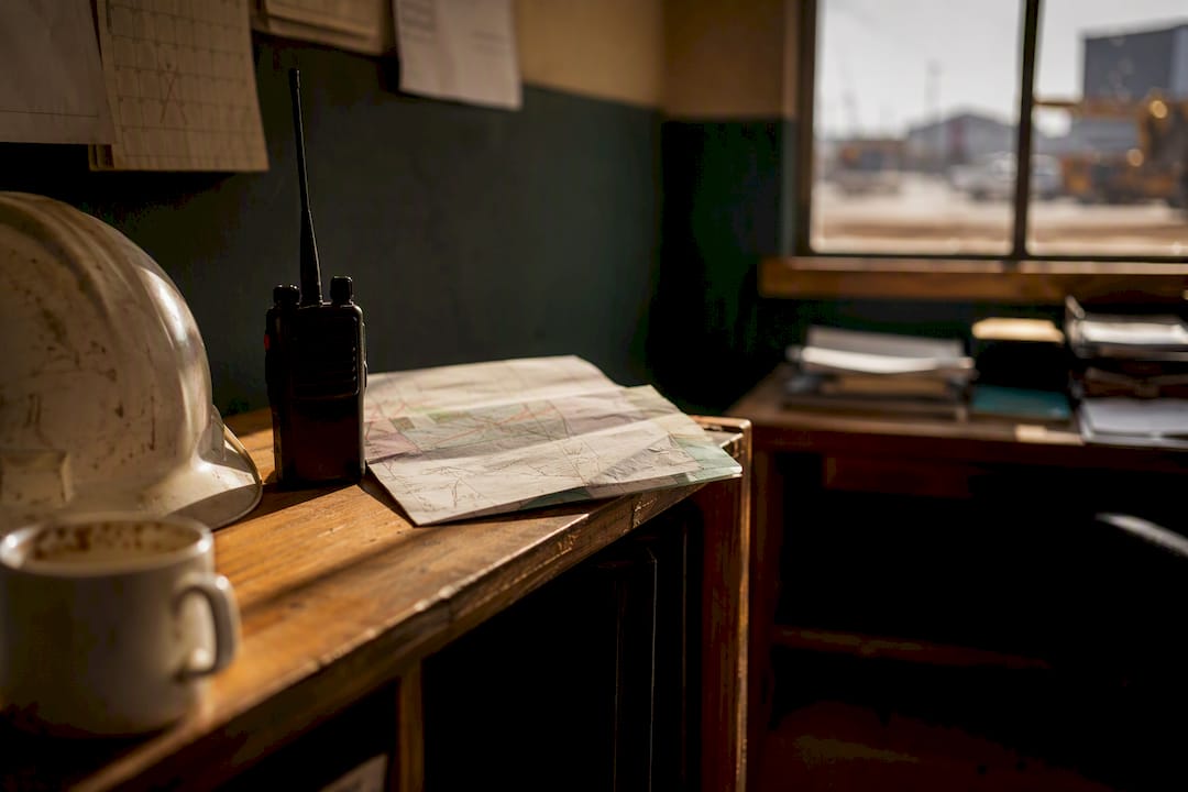 Desk with local site map and safety gear