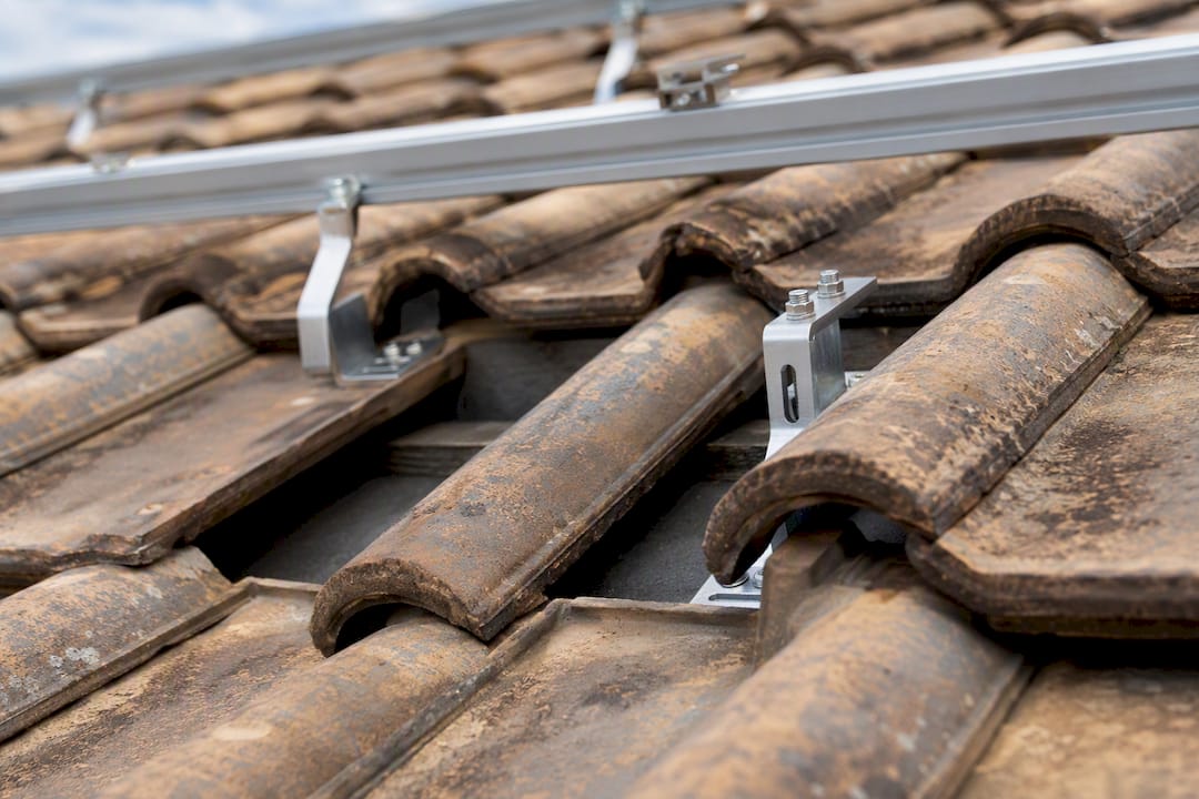 Hook and rail mount under lifted clay roof tile