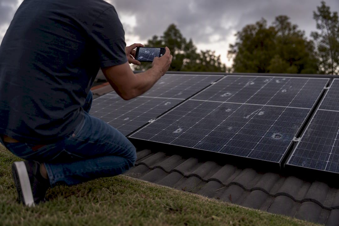 Homeowner capturing hail damage on solar panel