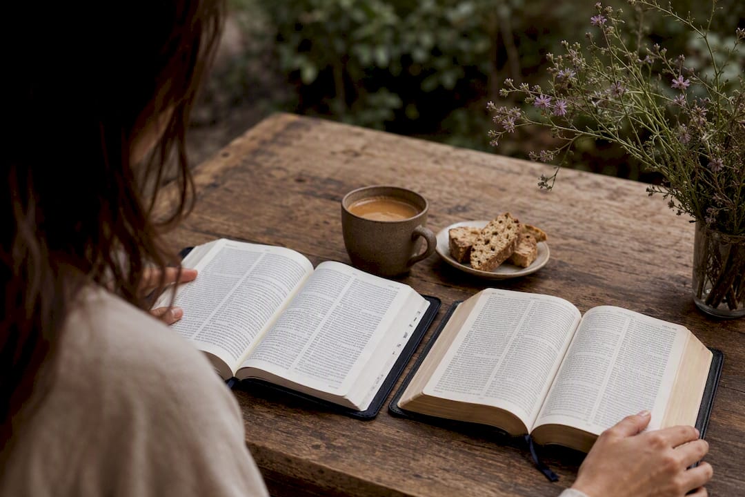 Open Italian and English Bibles with espresso and biscotti
