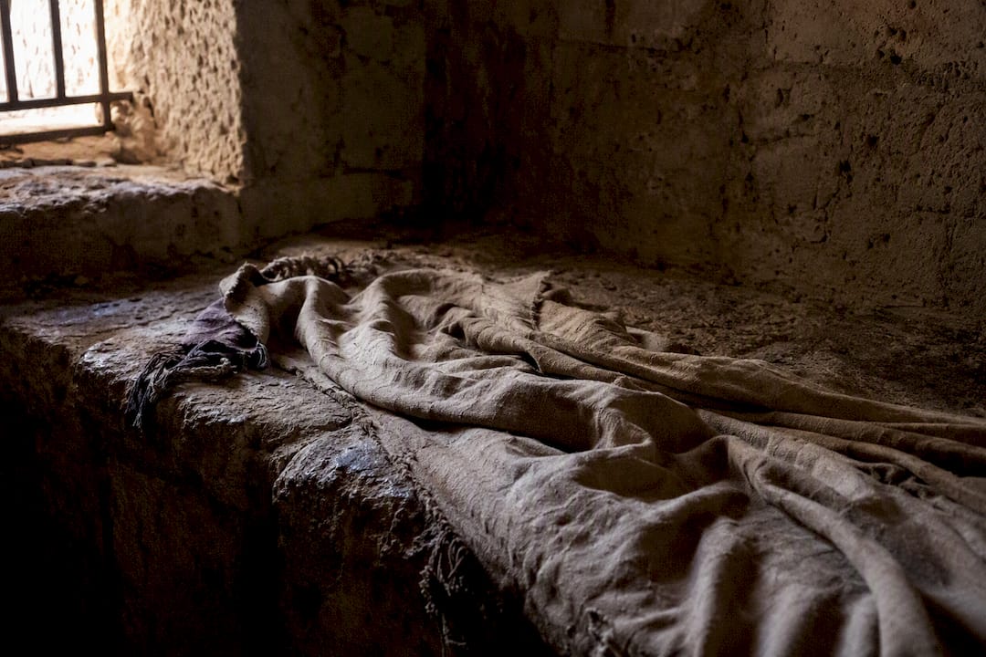 Ancient cloak left on stone floor
