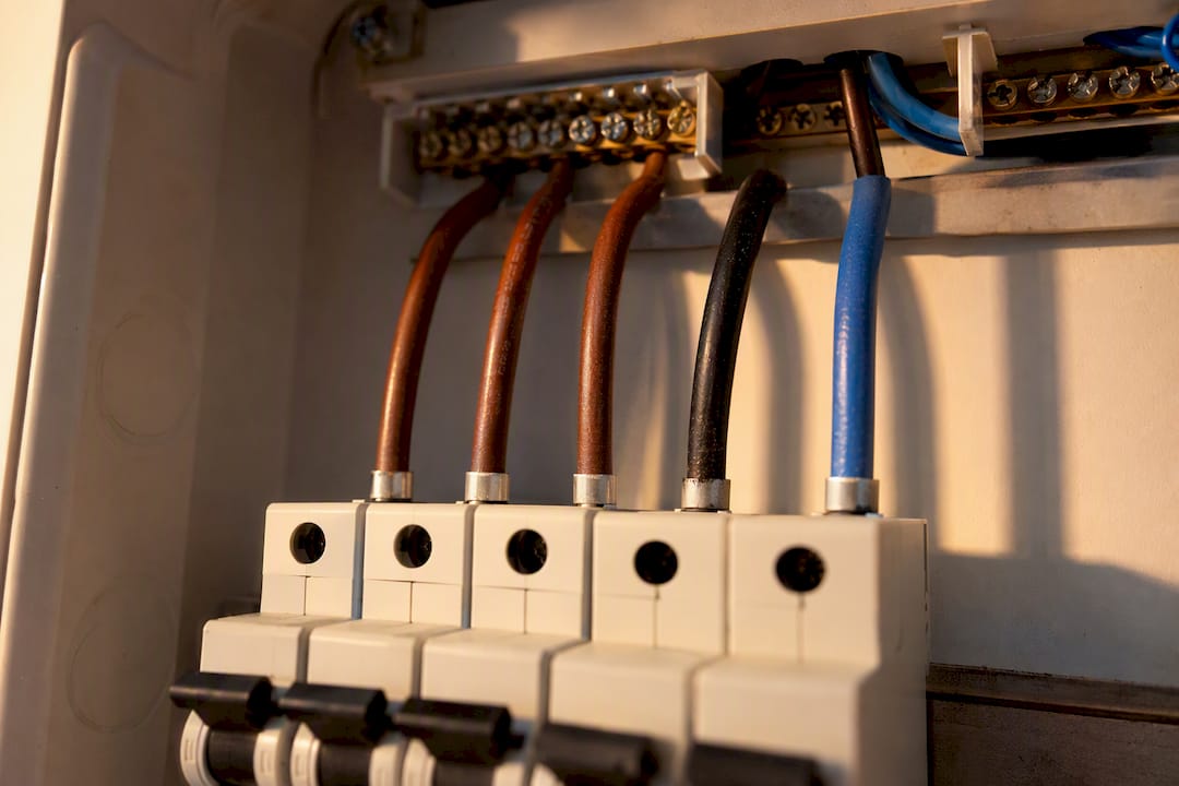 Close-up of three-phase distribution board wiring