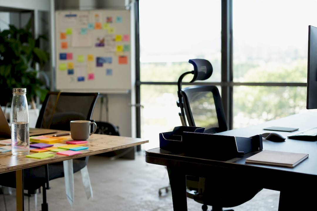 Contrasting desks showing startup and big tech workspaces
