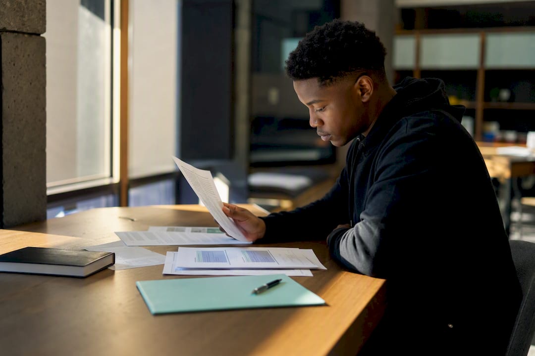 Student comparing bursary obligations and coverage
