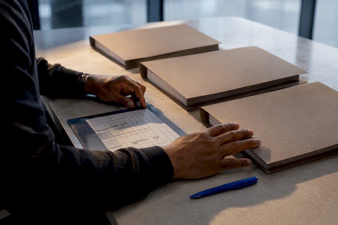 Journalist comparing archival case files