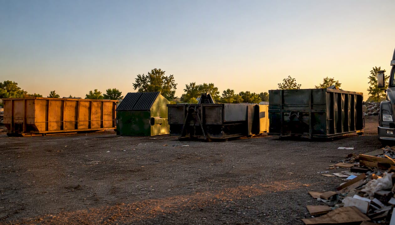 Various commercial container types side by side on site