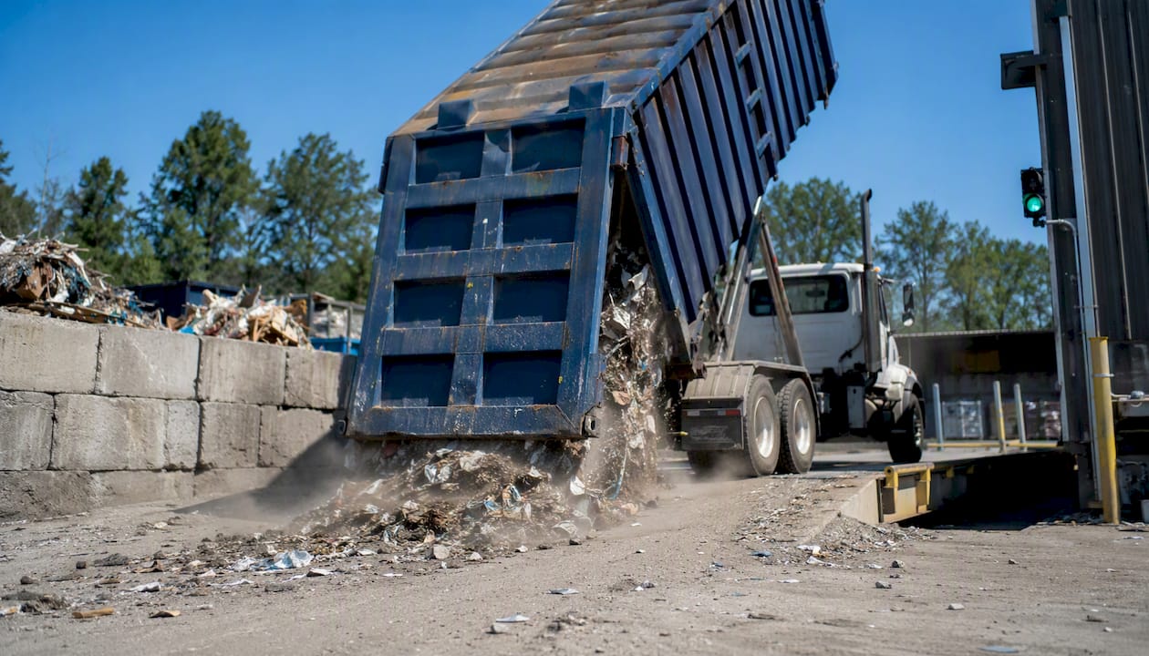 Skip bin unloading on weighbridge at facility
