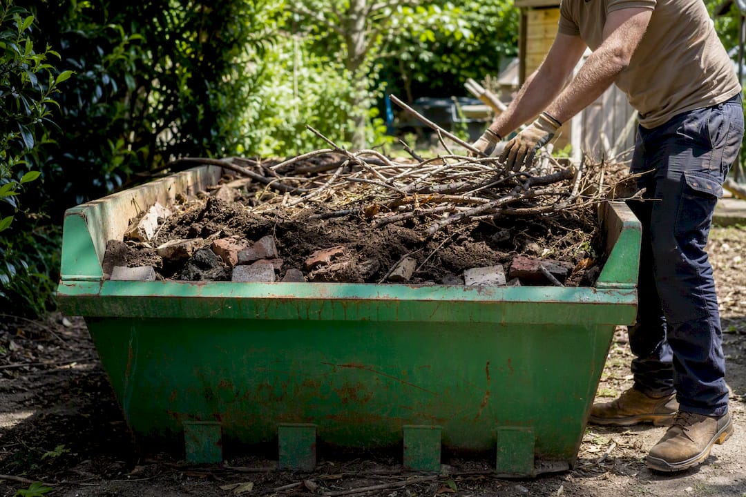 Packing skip bin with garden and heavy waste