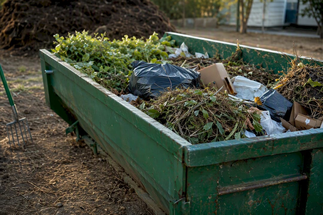 Skip bin filled with sorted garden and household waste