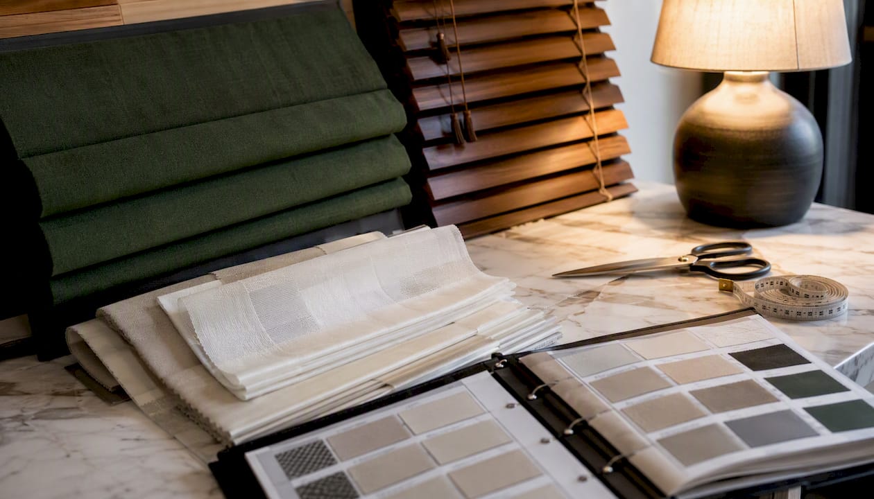 Flat lay of diverse window blind material samples