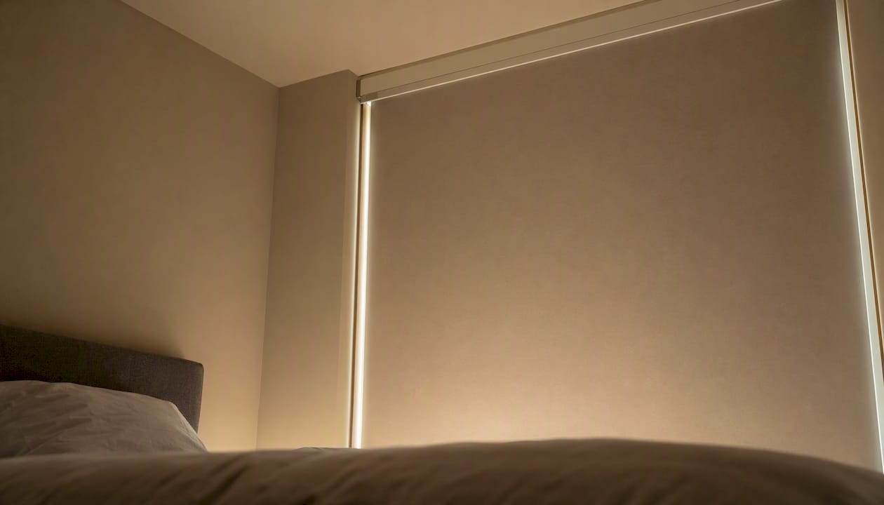 Side channels on corner window blinds for blackout