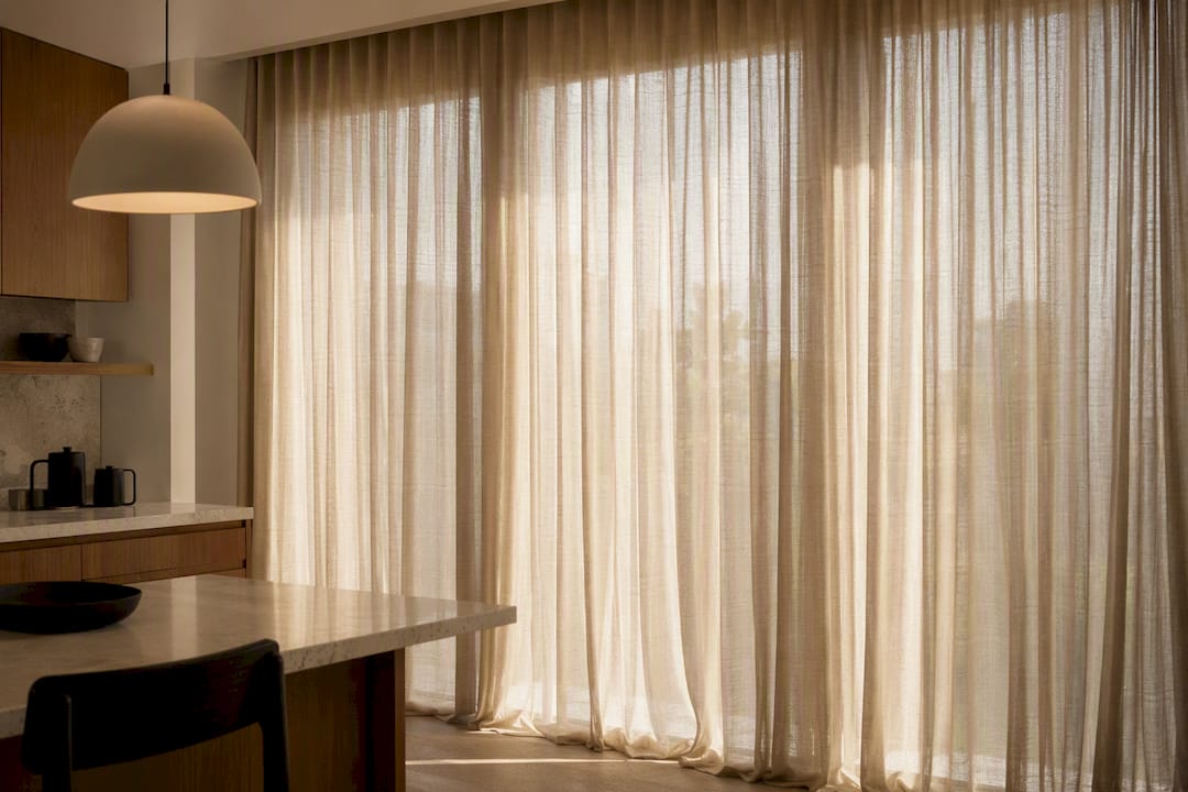 Large window styled with full-height drapes