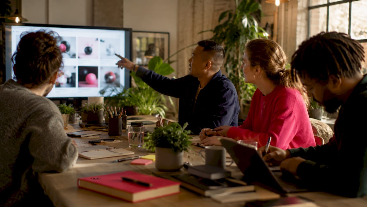 Marketing team collaborating with AI tools