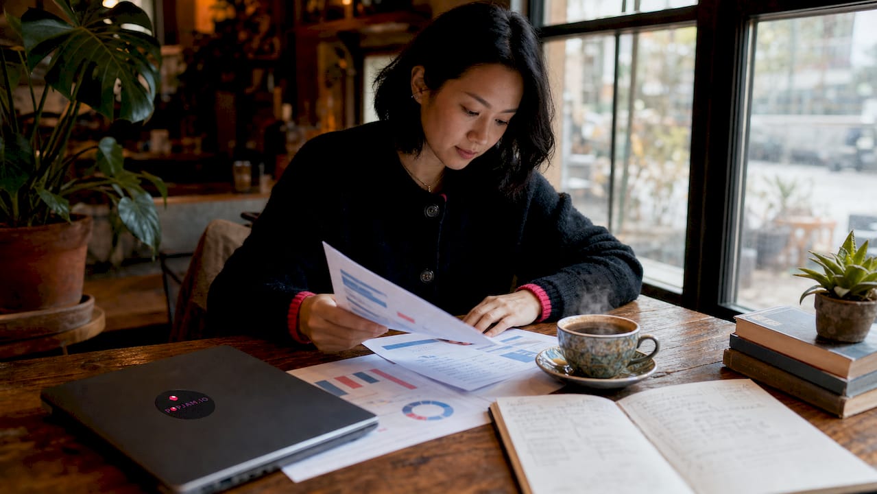 Professional reviewing customer data sheets