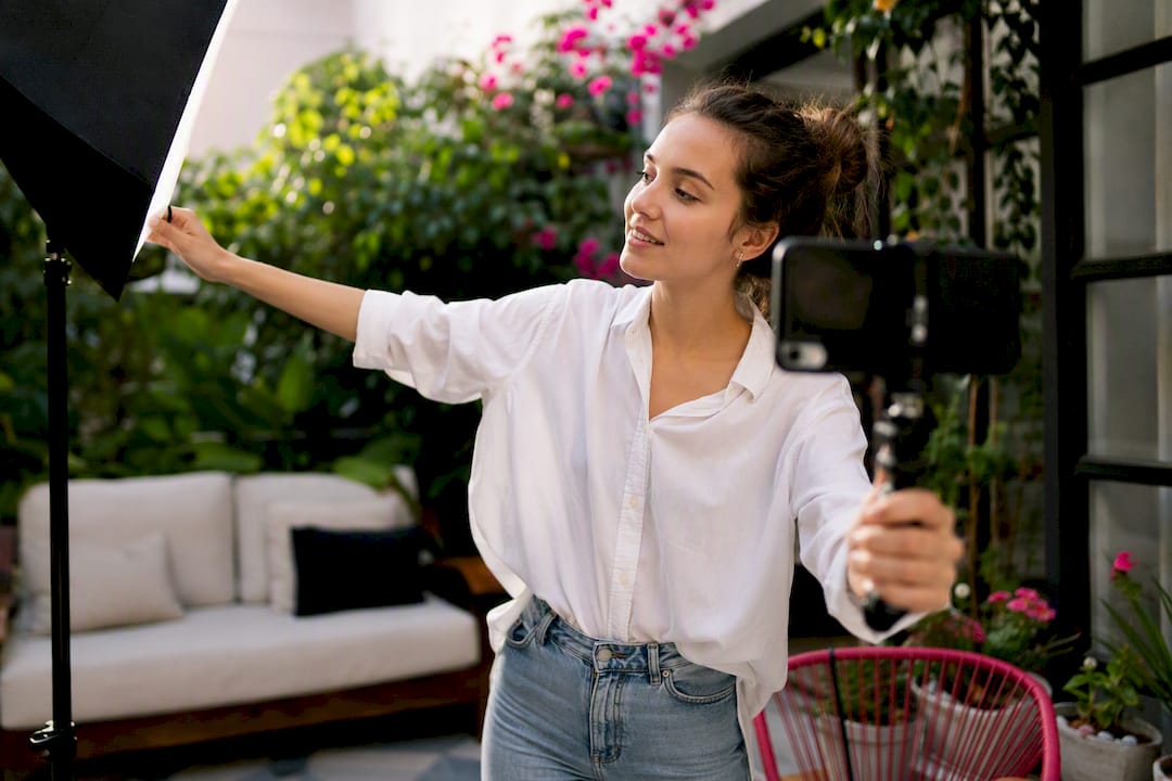 Creator filming UGC video with smartphone