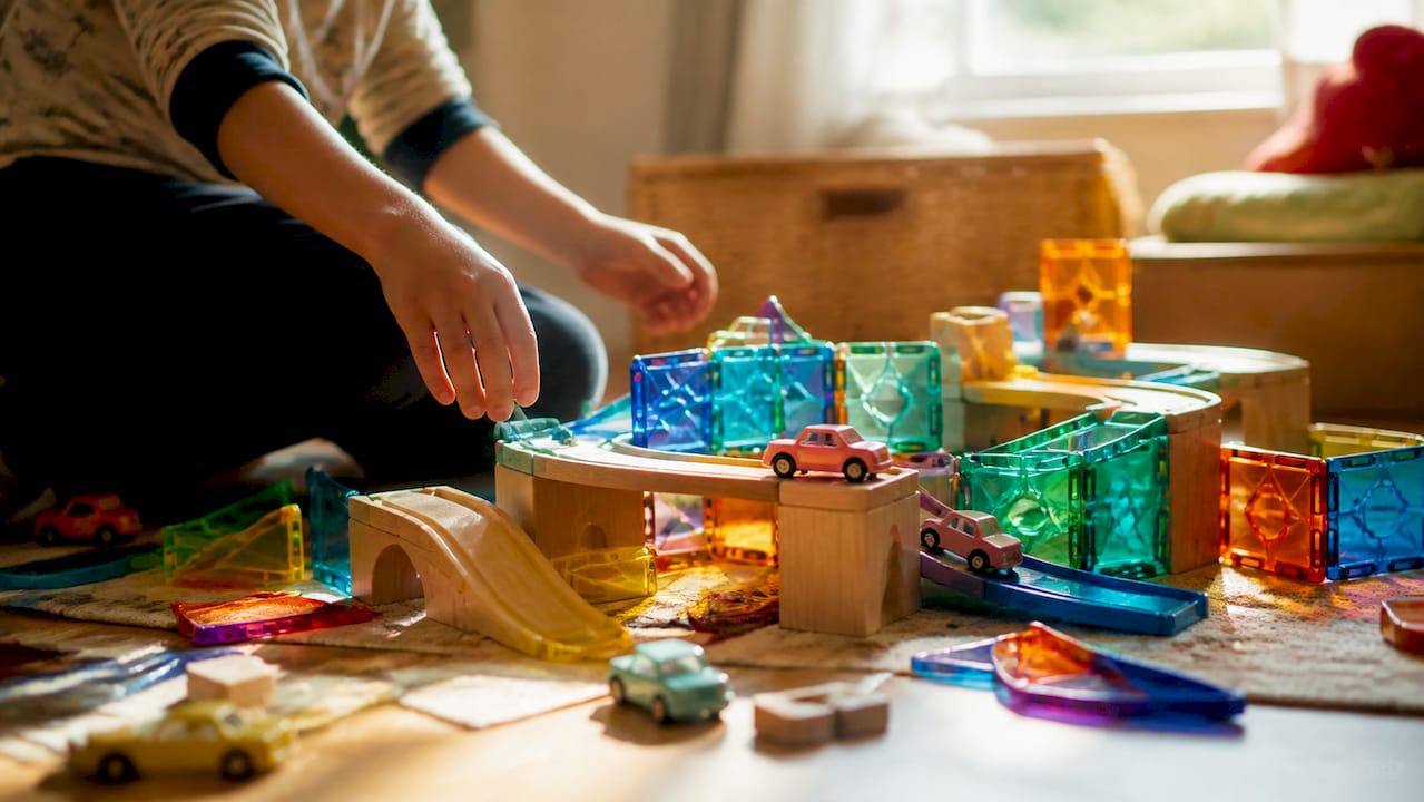Magnet tiles combined with blocks and toy cars