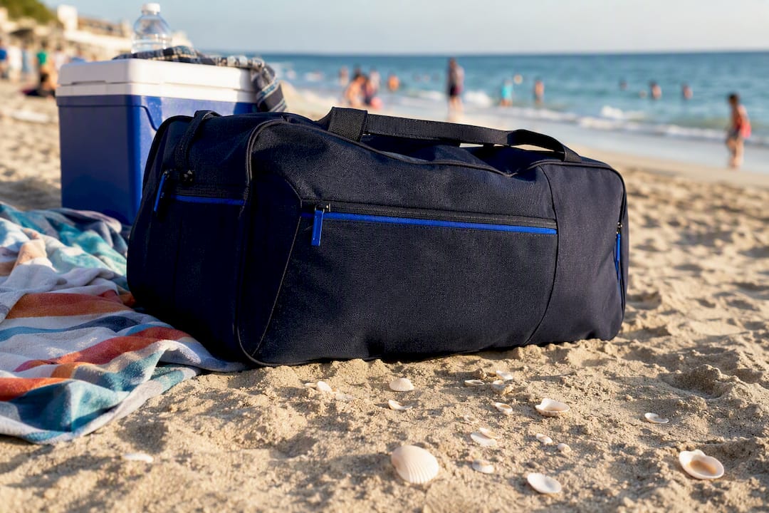 Travel bag exposed to sunlight on hot ground