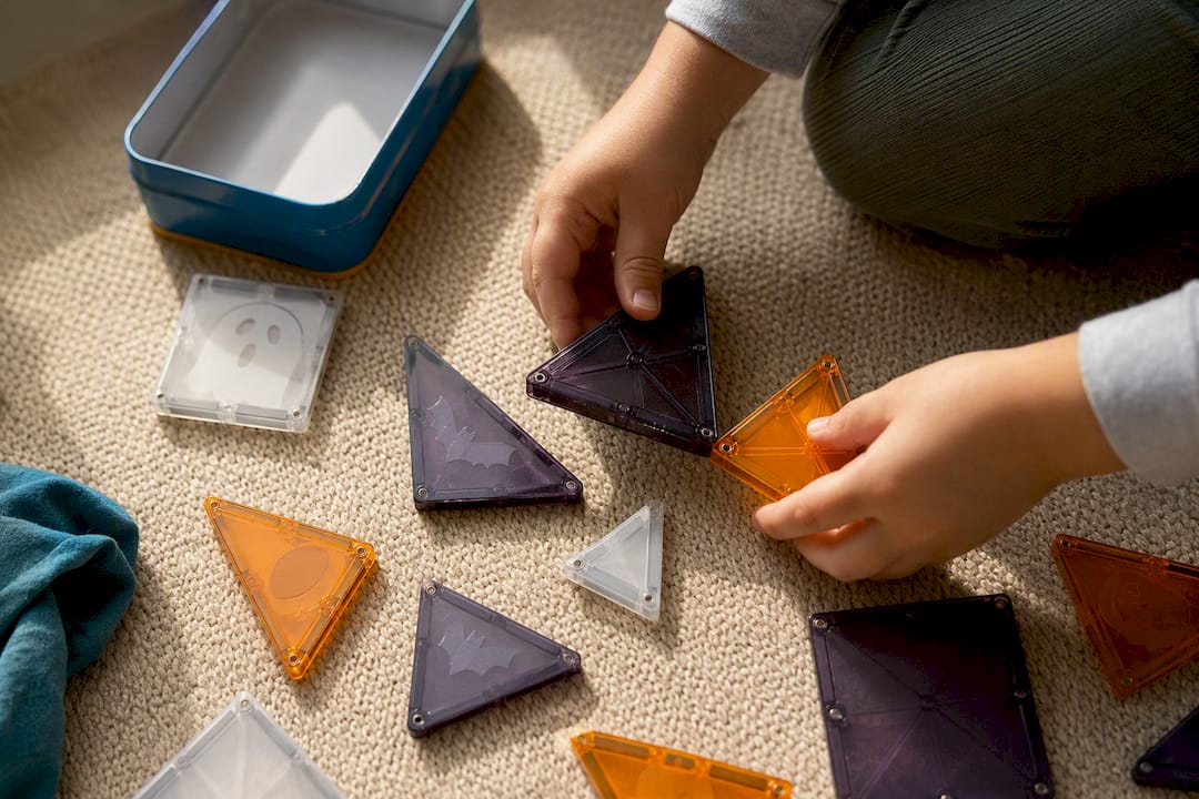 Child building with spooky magnetic pieces