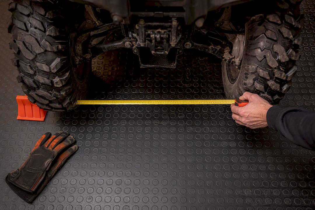 Measuring ATV tire stance for plow sizing