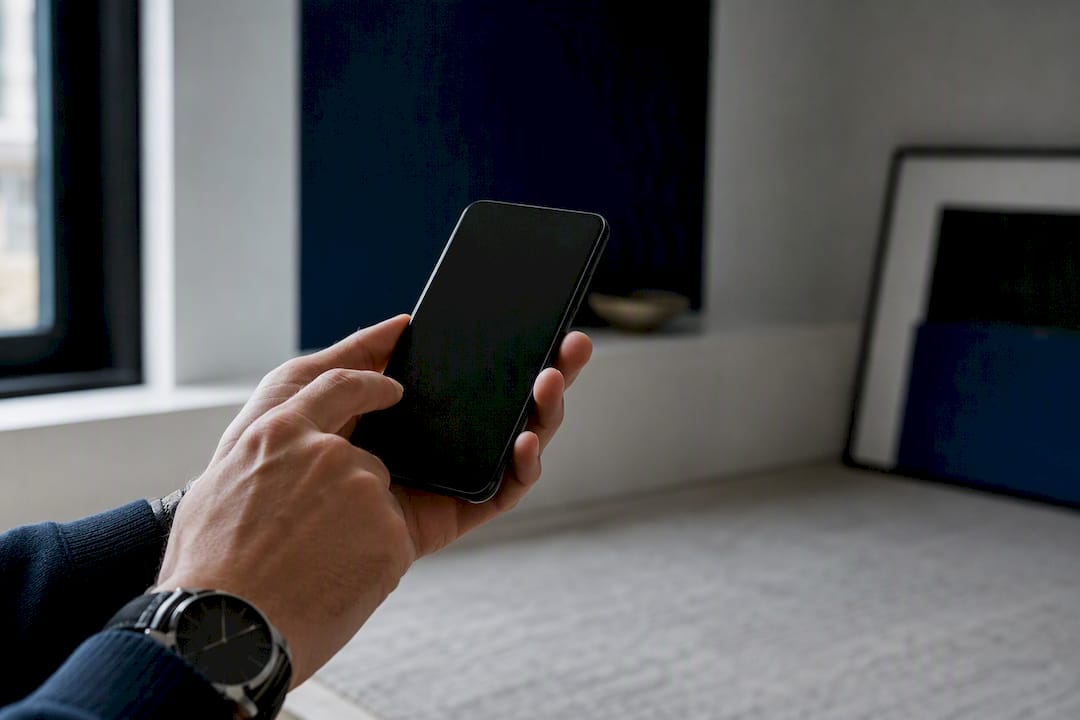 Hands holding smartphone engaging chatbot lead capture