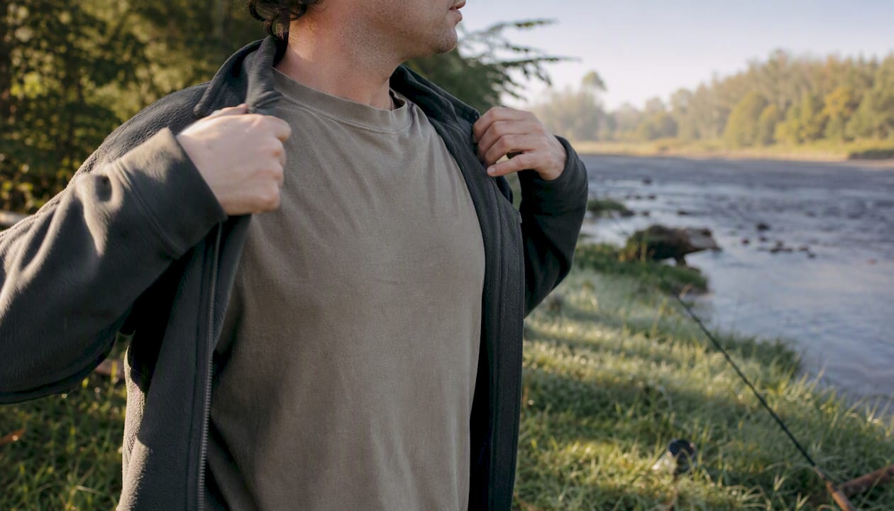 Layering fleece over badge tee at mild dawn