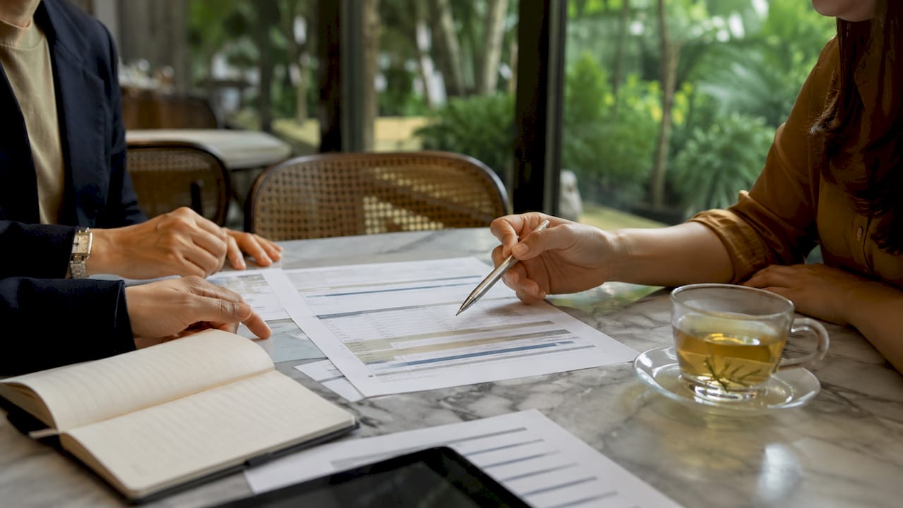 Hands discussing staged payment contract risks