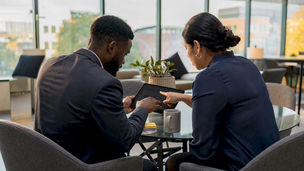 Professionals discussing B2B buyer behavior