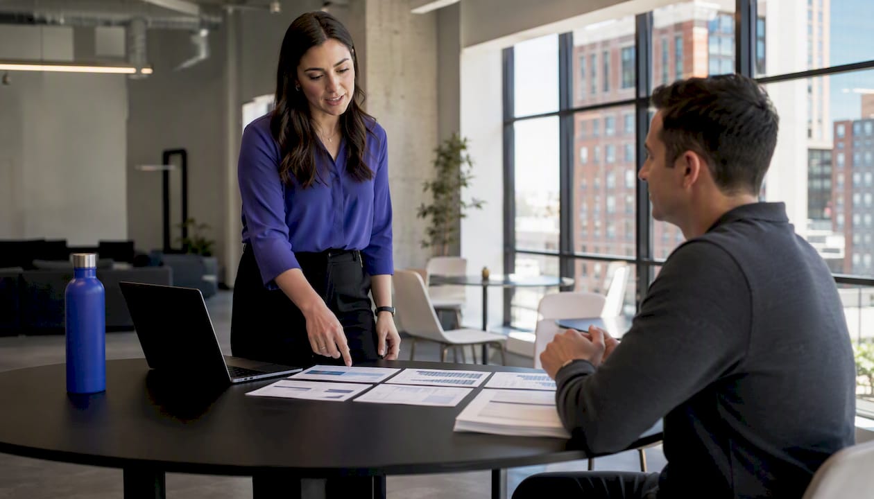 Sales manager reviewing coaching scorecards