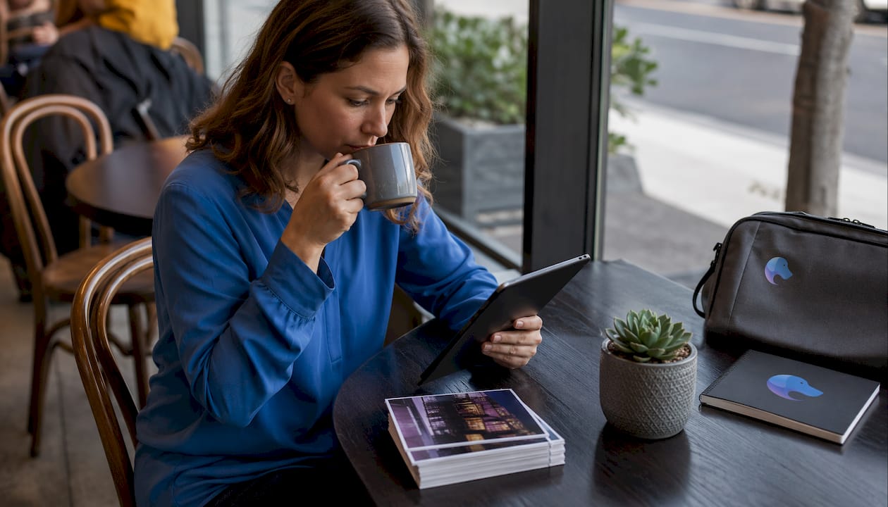 Woman submitting event listings on tablet