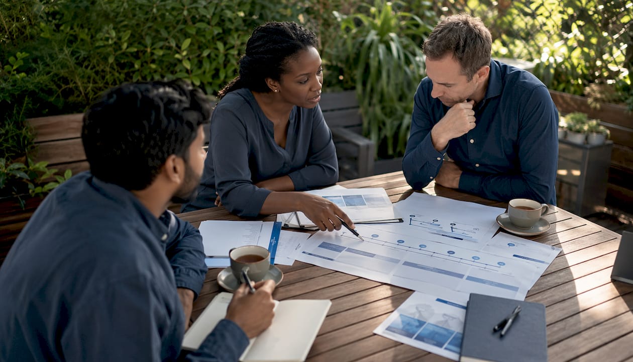 Diverse team discussing stage-gated roadmap