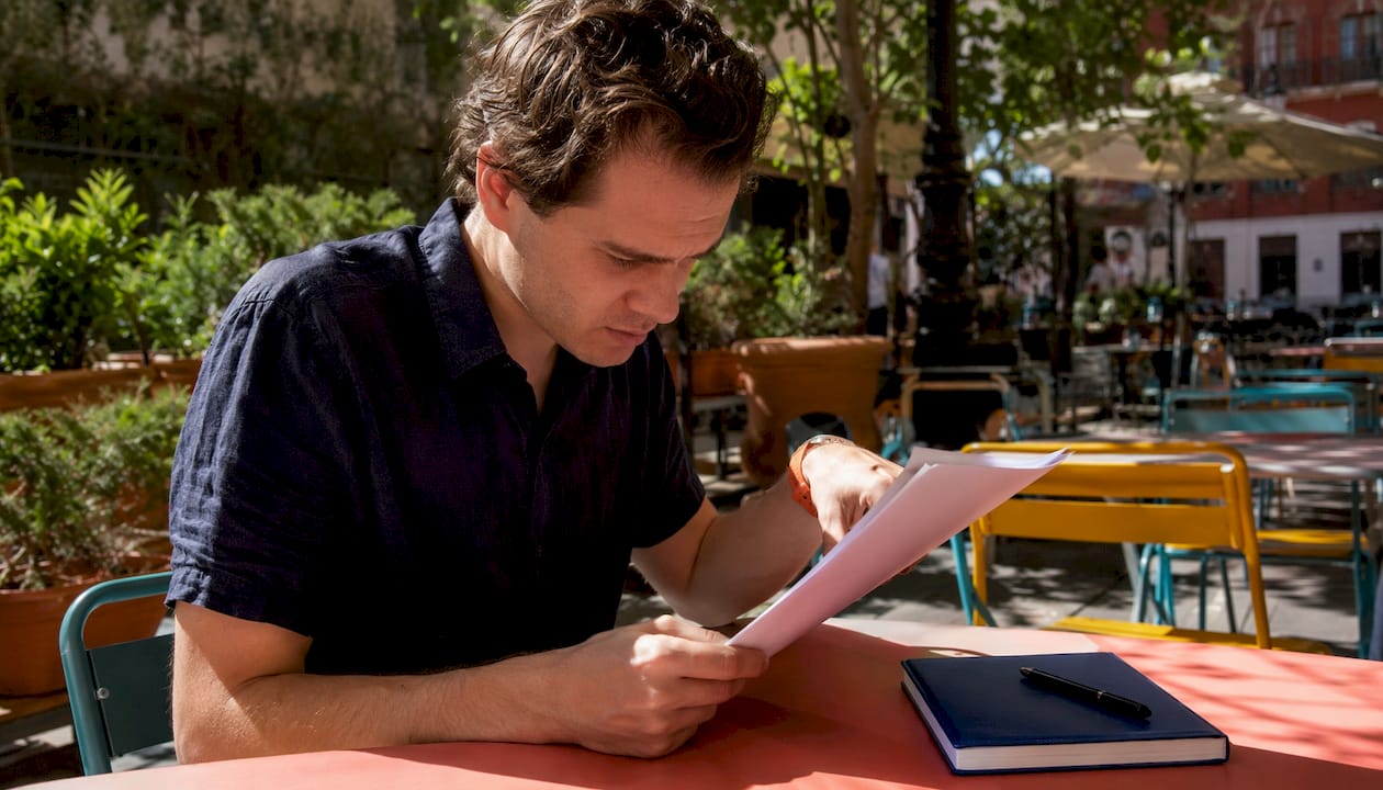 Man reading consulate insurance checklist
