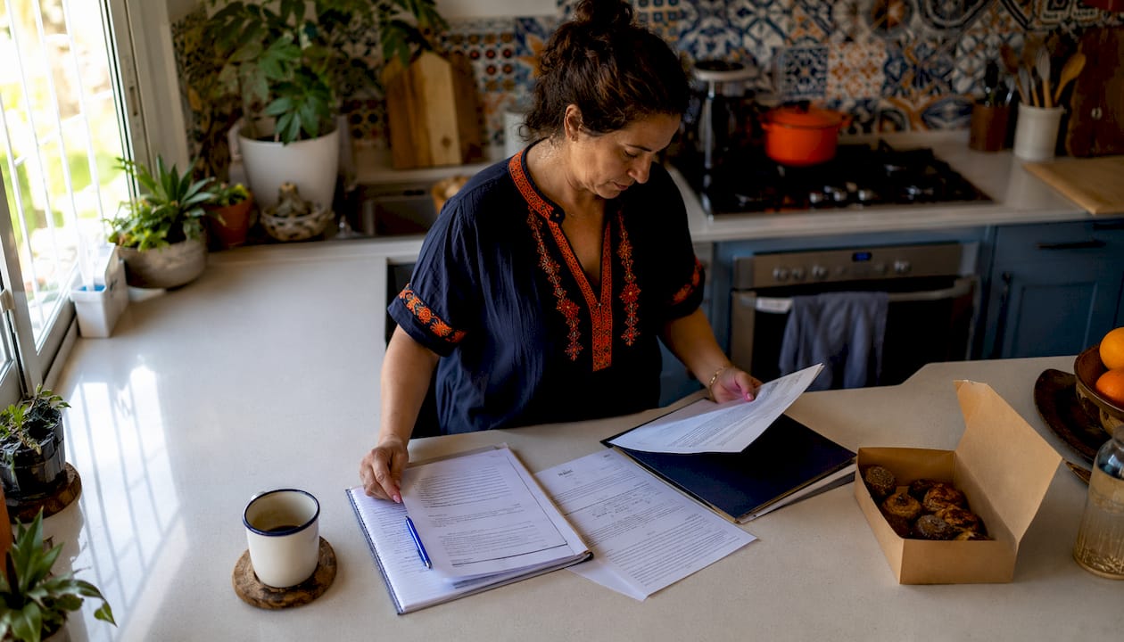 Woman reviewing Spanish visa insurance papers