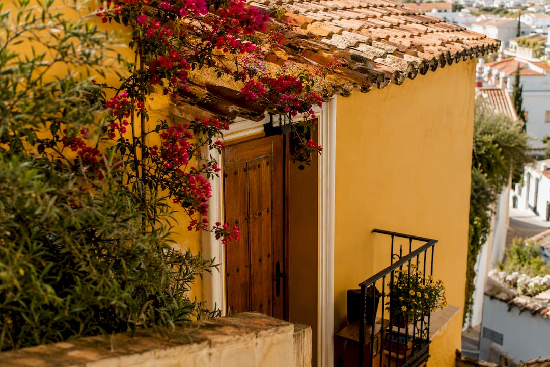 Spanish rental property exterior in sunlight