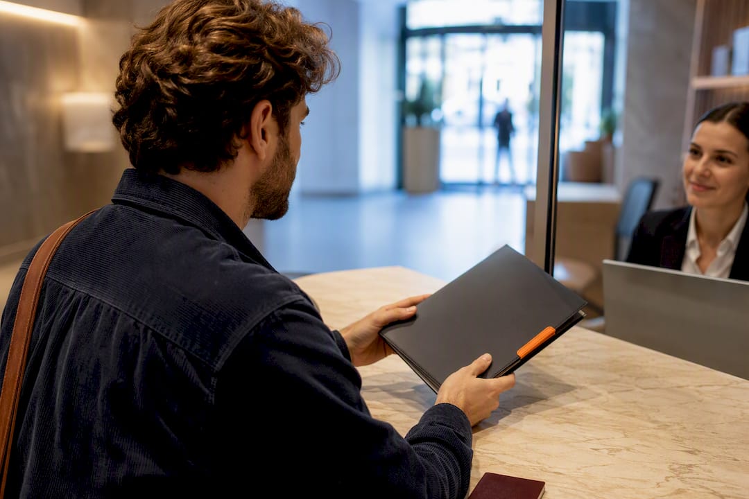 Student submitting Spain visa application folder