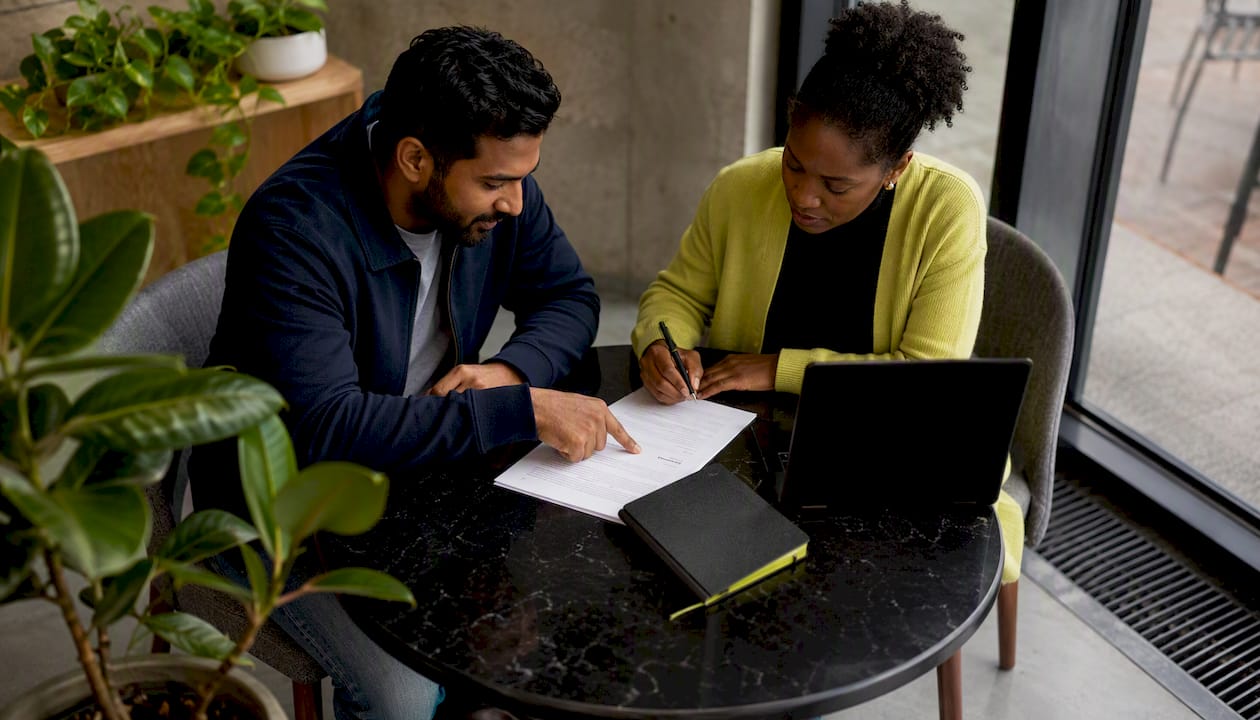 Two contractors discussing contract terms