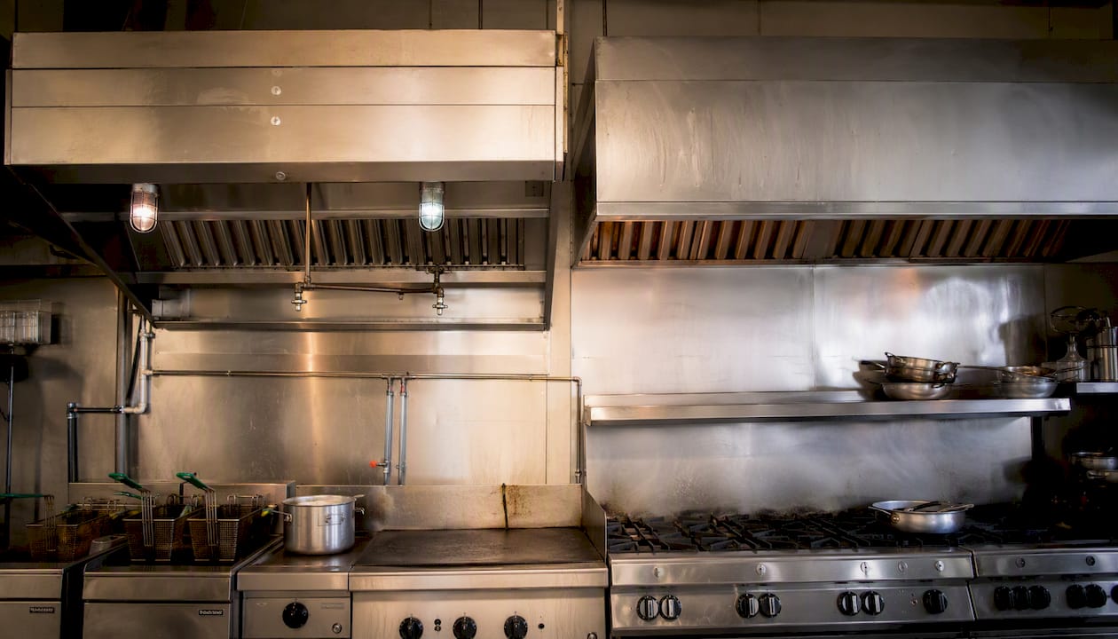 Type I and Type II commercial kitchen ventilation hoods side by side