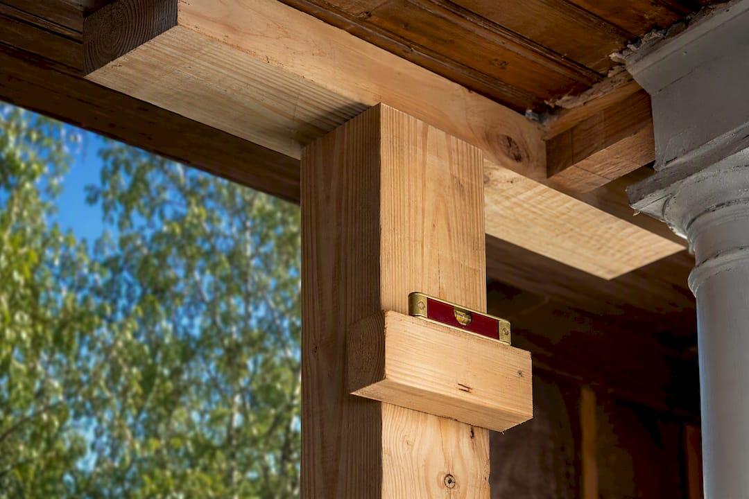 Temporary timber shoring beneath historic porch
