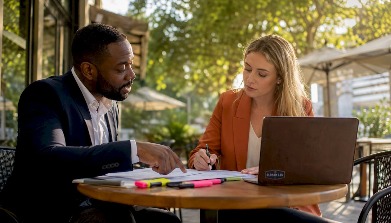 Two professionals discussing contract enforceability