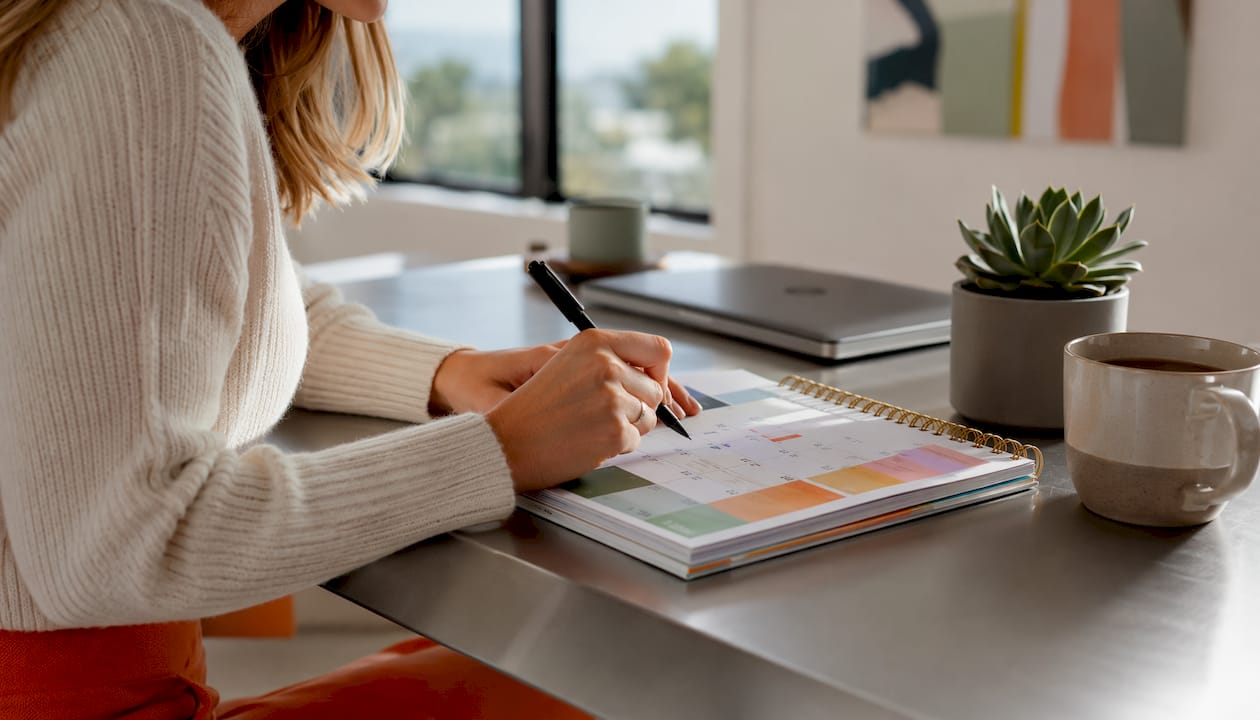 Close-up hands marking real estate contingency deadline