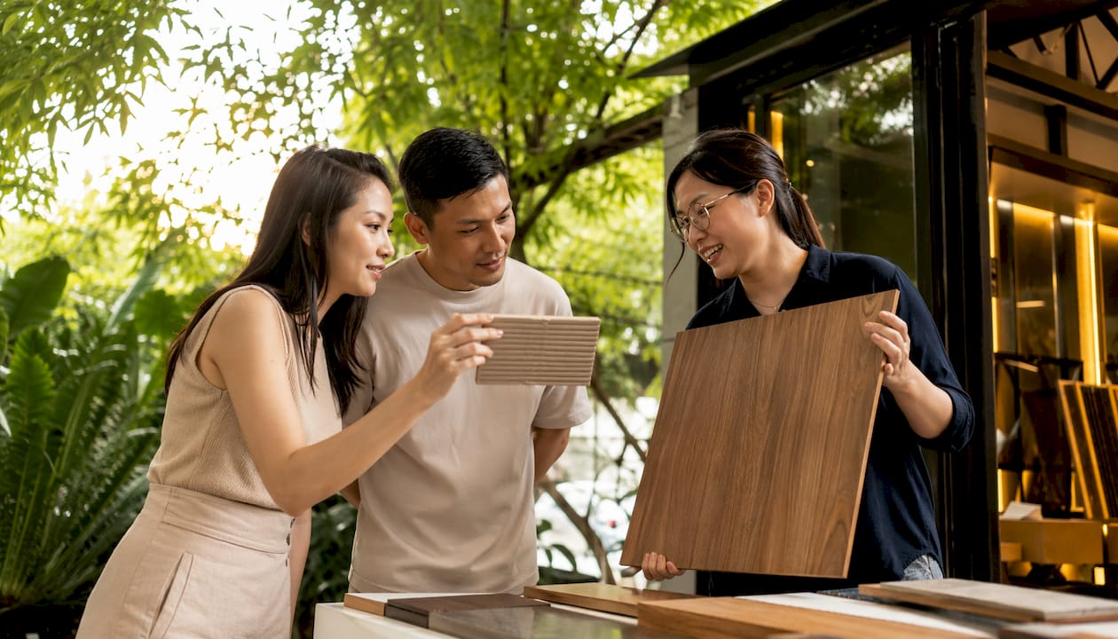 Couple consulting on wood wall panel options