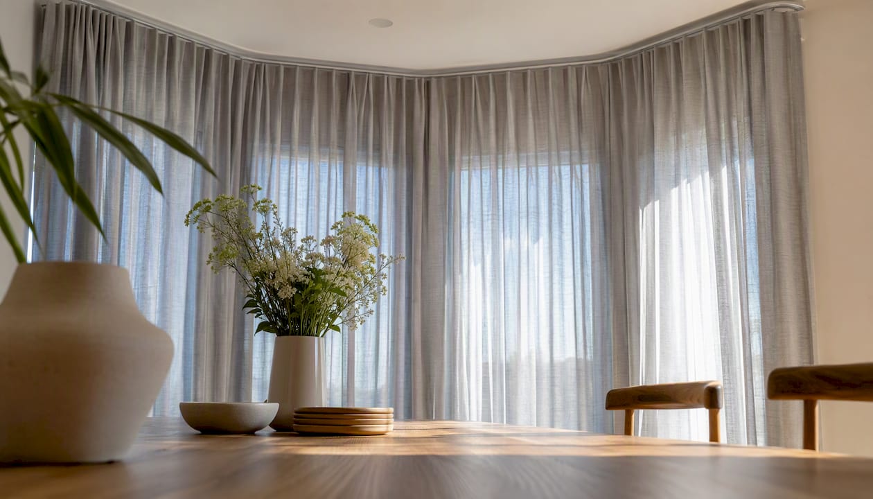 Curved curtain track on bay window ceiling